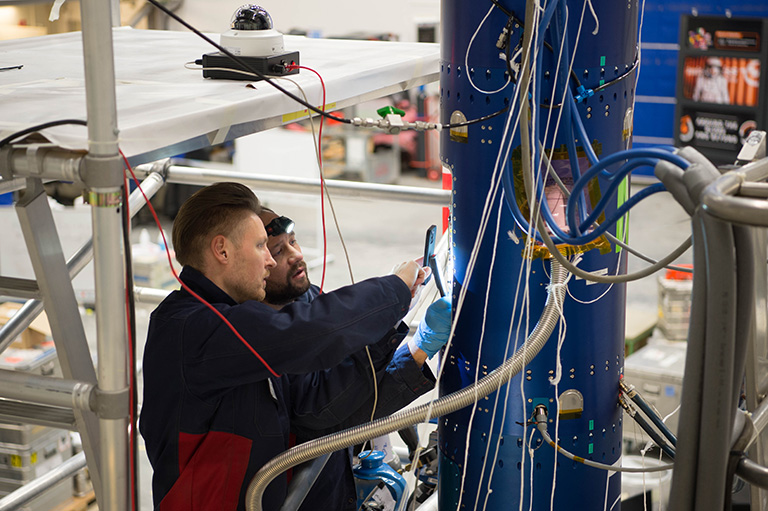 Engineers working with a rocket