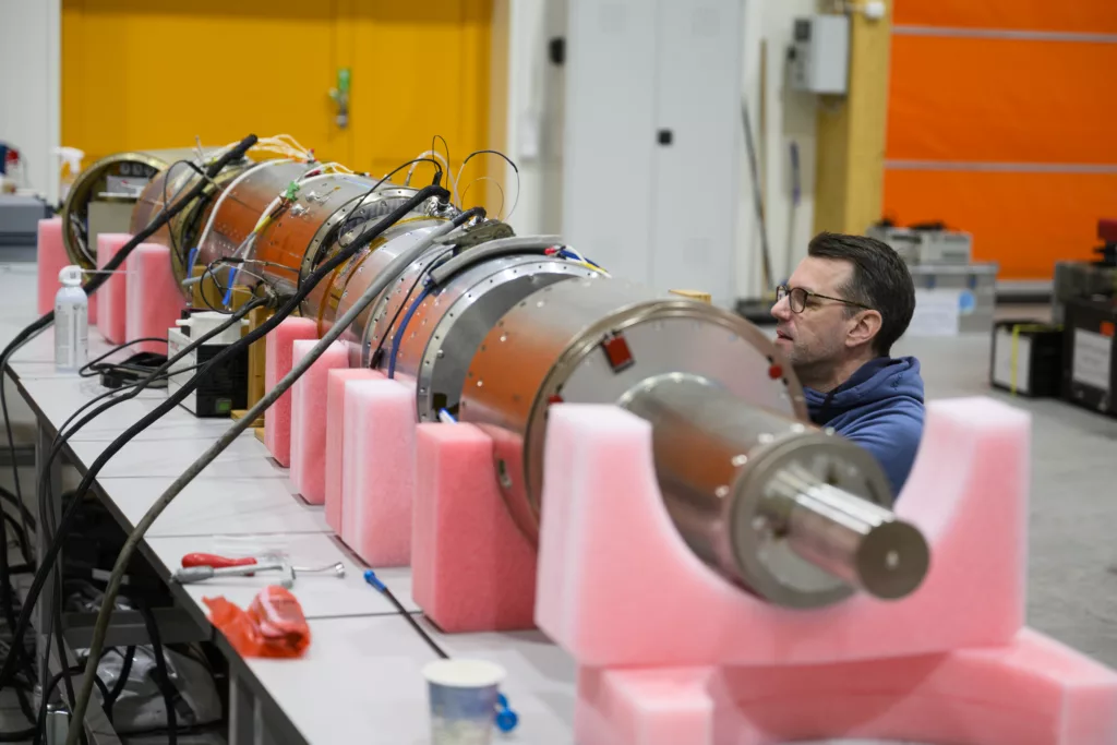 A male working on the rocket payload