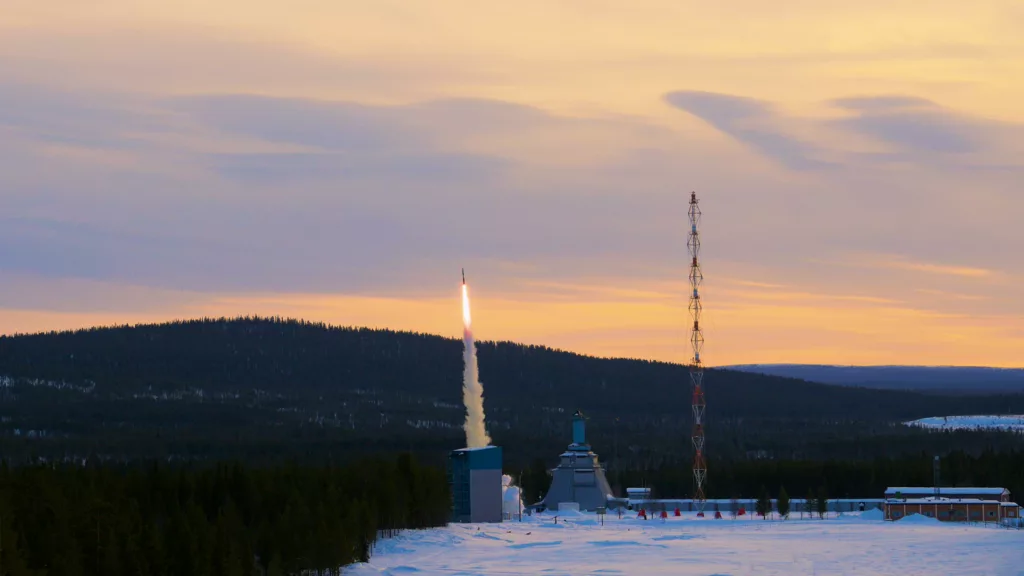 Rocket launched with a colorful sky as backdrop