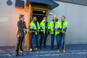 Five persons cutting the ribbon on the inauguration ceremony