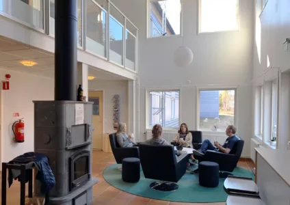 Lobby area with community space and a stove