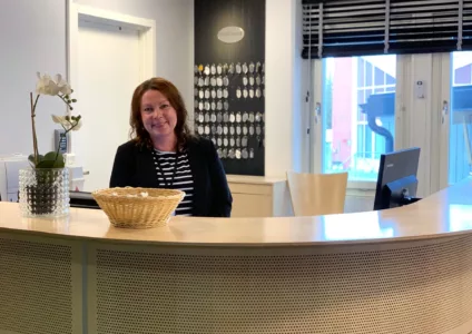 Sari welcoming guests at the reception