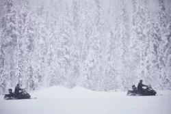 Snowmobiles at Esrange in a snowy forest Snowmobiles