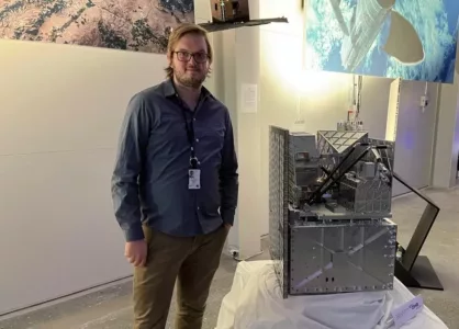 Rikard next to the MATS satellite built by OHB Sweden, which he worked with during his thesis. Rikard and the Swedish MATS satellite